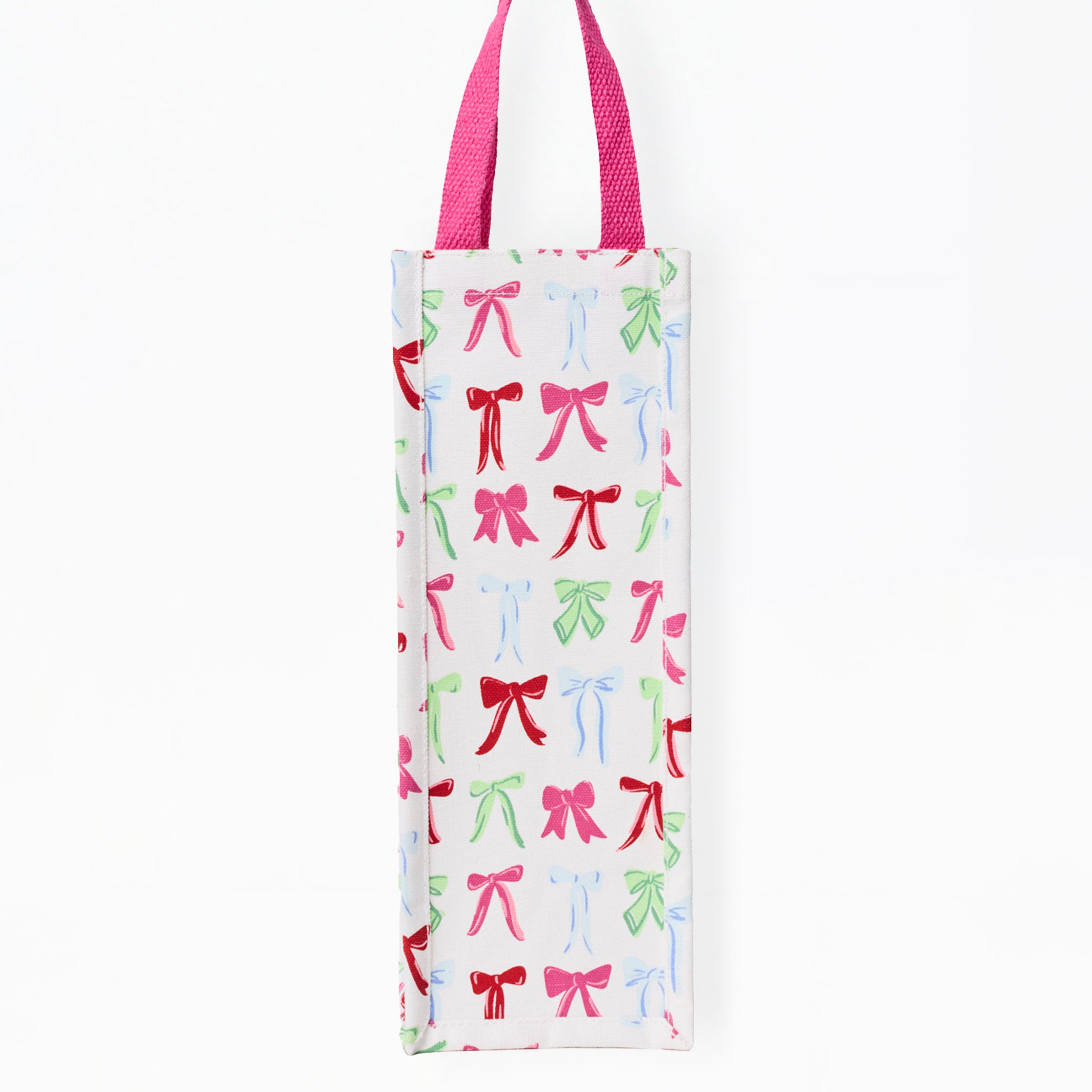 A white canvas tote bag with a repeating pattern of colorful ballet pointe shoes in pink, green, and blue, featuring magenta handles.
