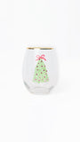 A clear stemless wine glass with a gold rim, featuring a printed green Christmas tree with red ornaments and a red bow on the front, set against a plain white background.