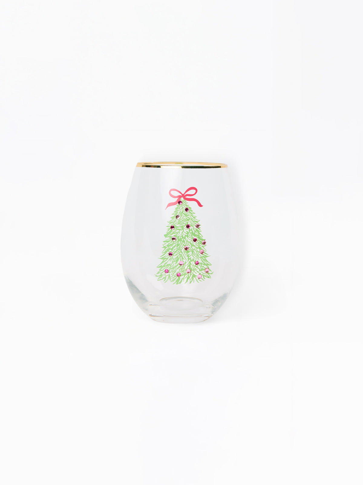 A clear stemless wine glass with a gold rim, featuring a printed green Christmas tree with red ornaments and a red bow on the front, set against a plain white background.