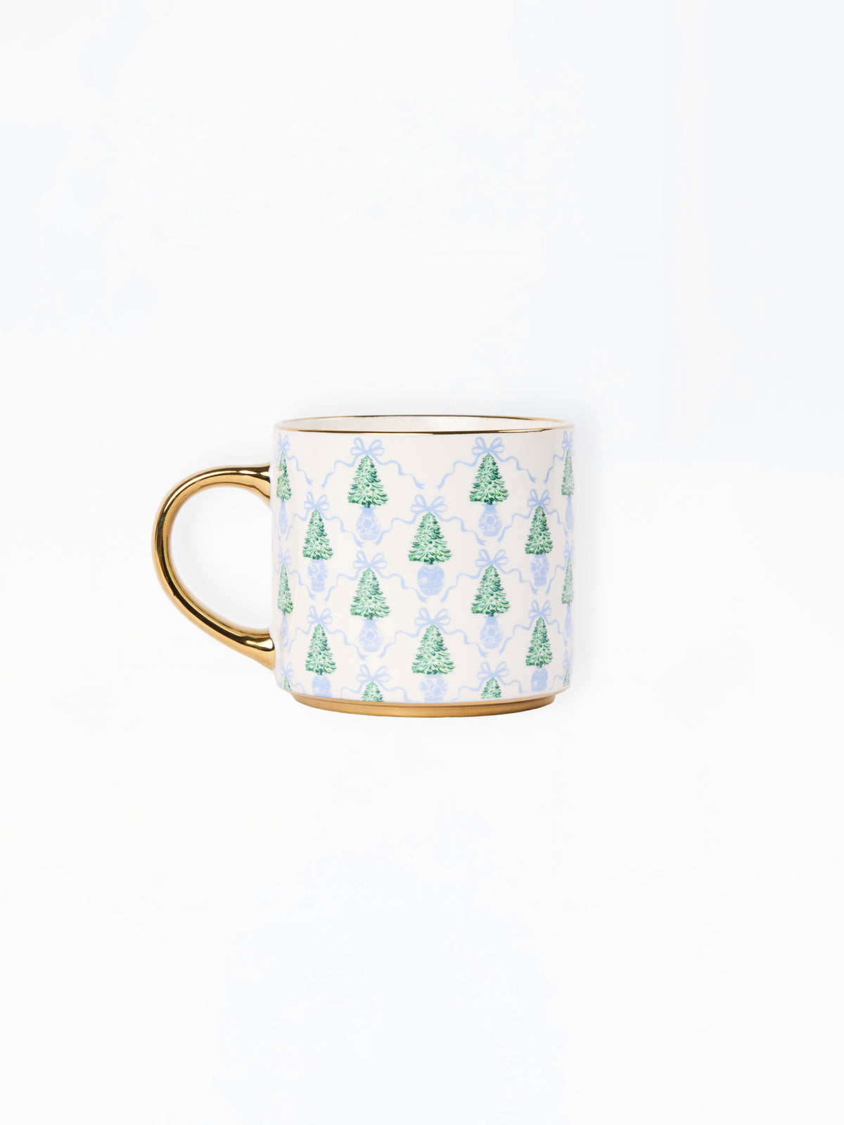 A white ceramic mug with a gold handle and base trim, decorated with a repeating pattern of green Christmas trees and light blue damask motifs.