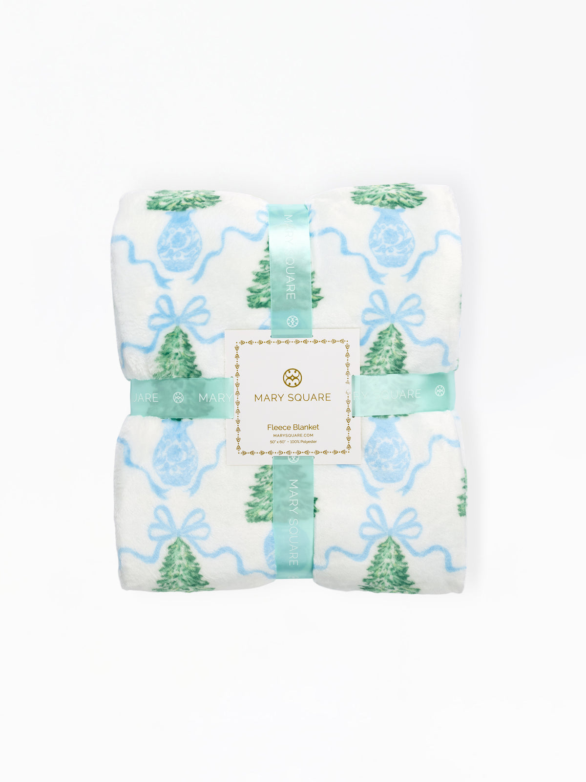 A folded Mary Square flannel blanket with a festive holiday print, featuring green pine trees, blue ornaments, and light blue wavy lines on a white background, wrapped in a matching mint green ribbon with a central brand label.