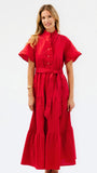 A woman modeling a bright red midi dress with short flutter sleeves, a high collar, buttoned front, and a matching waist tie, photographed against a plain white studio background.