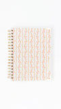 Notebook with decorative cover on a white background