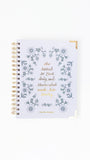 Notebook with floral design and text on a white background