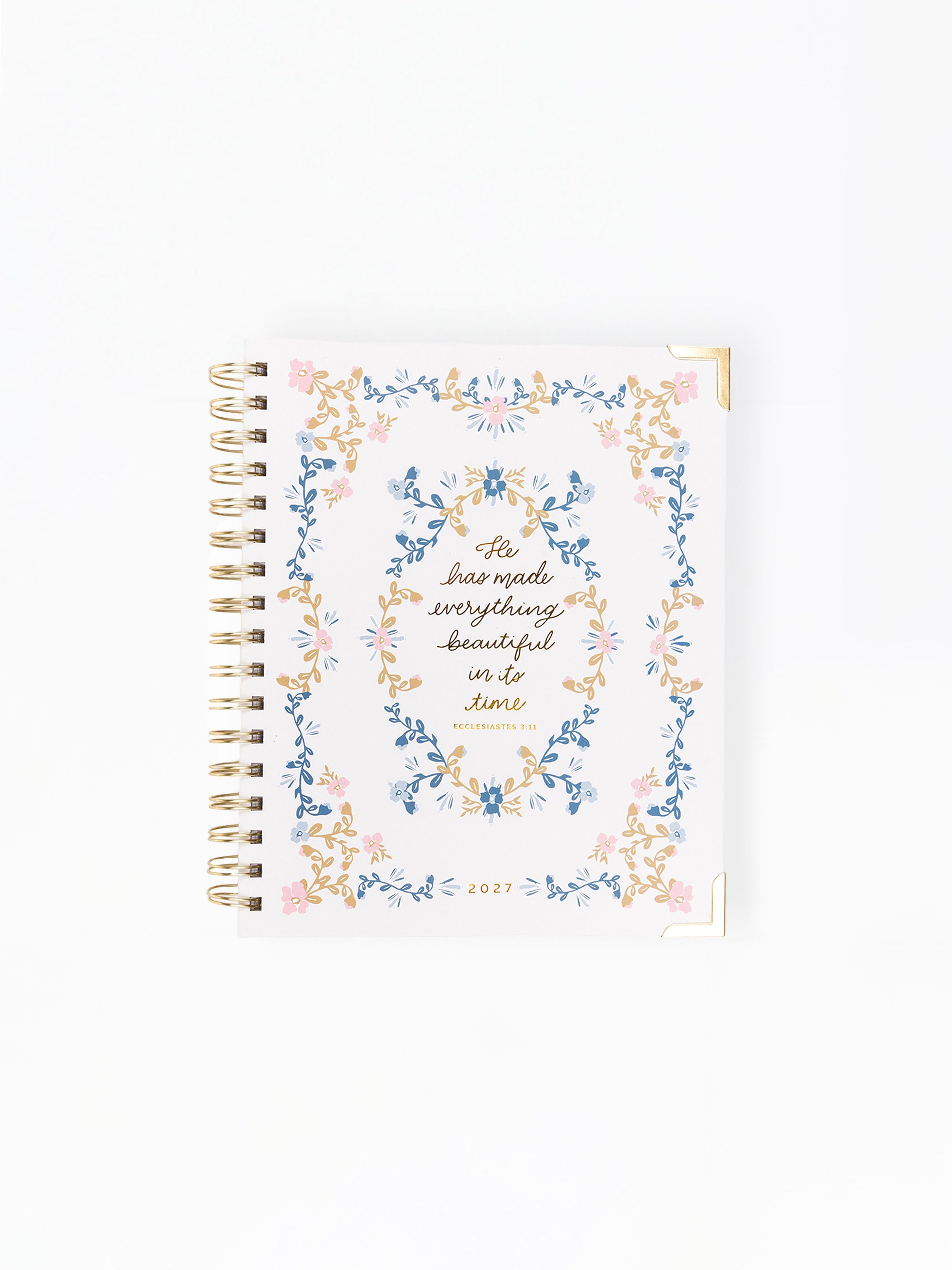 Notebook with floral design and text on a white background