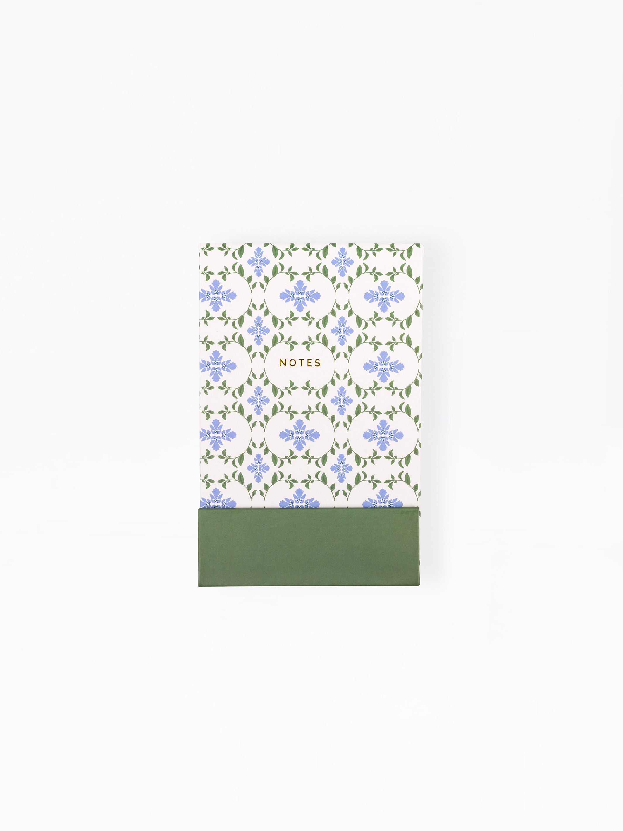 Notebook with floral pattern and green base on a white background