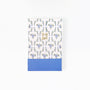 Notebook with floral design and 'to do list' text on a white background