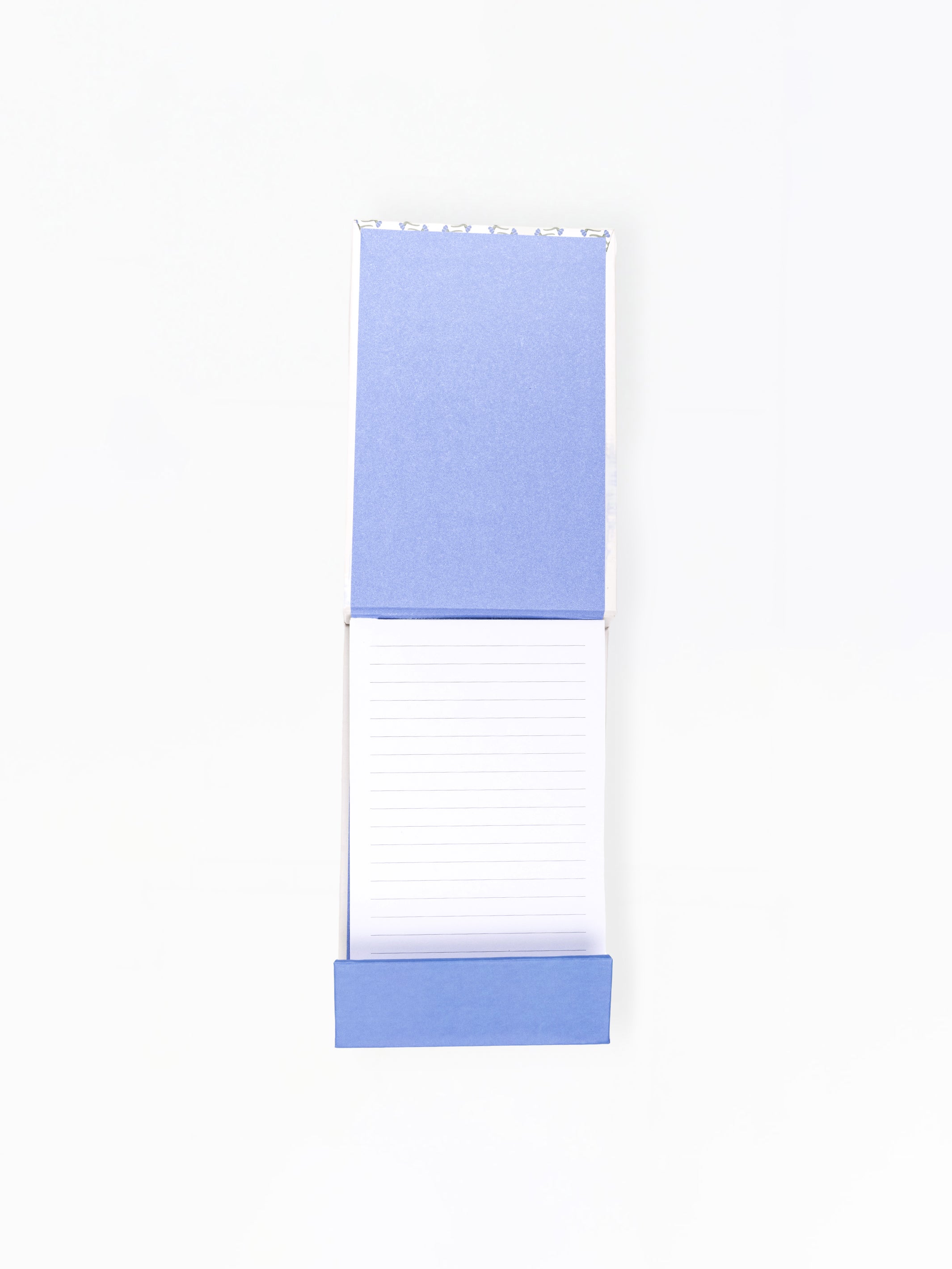 Open notepad with blue top and white bottom on a white background