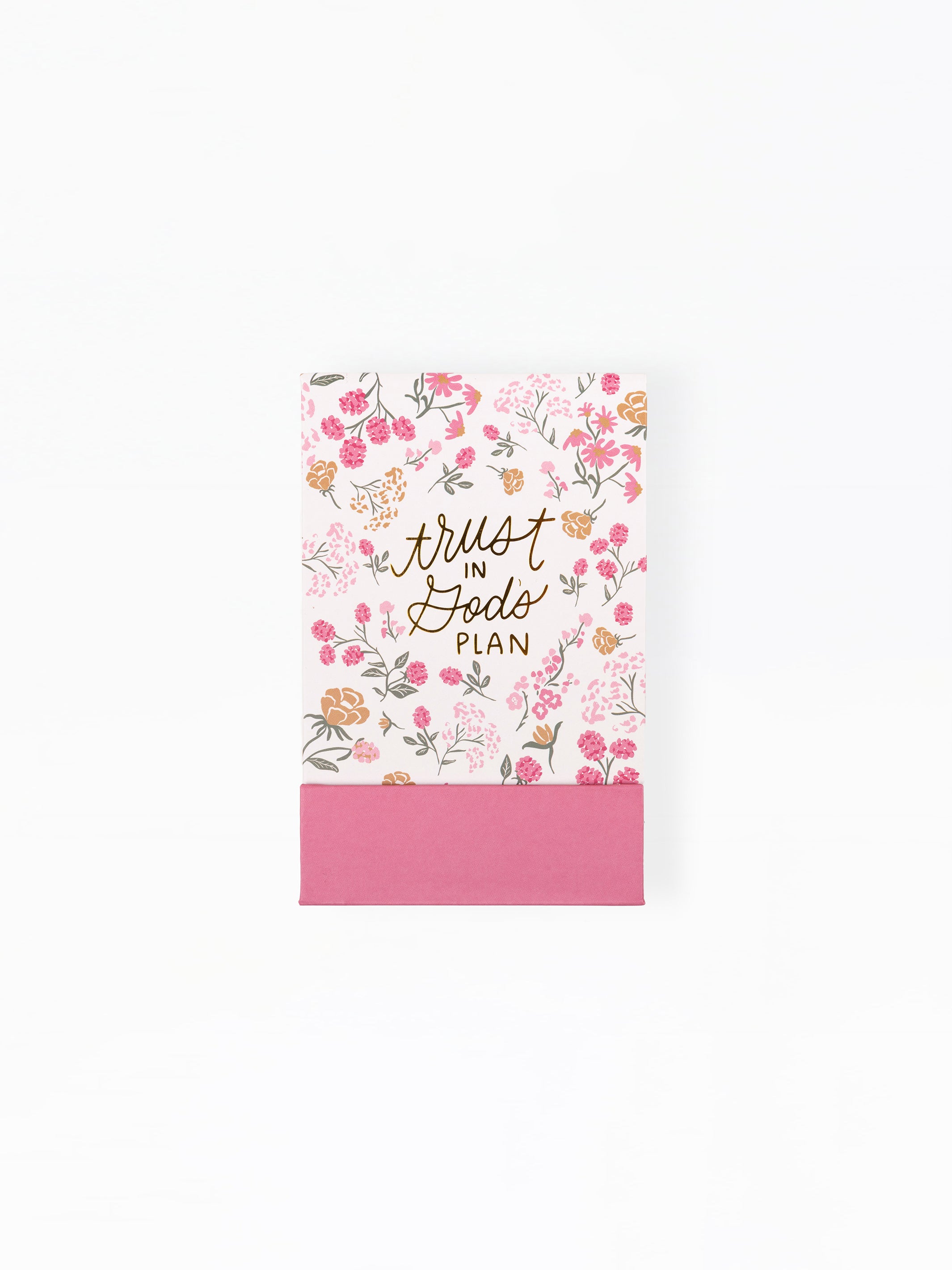Notebook with floral design and 'Trust God's Plan' text on a white background