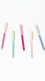 Five colorful pens with gradient designs on a white background
