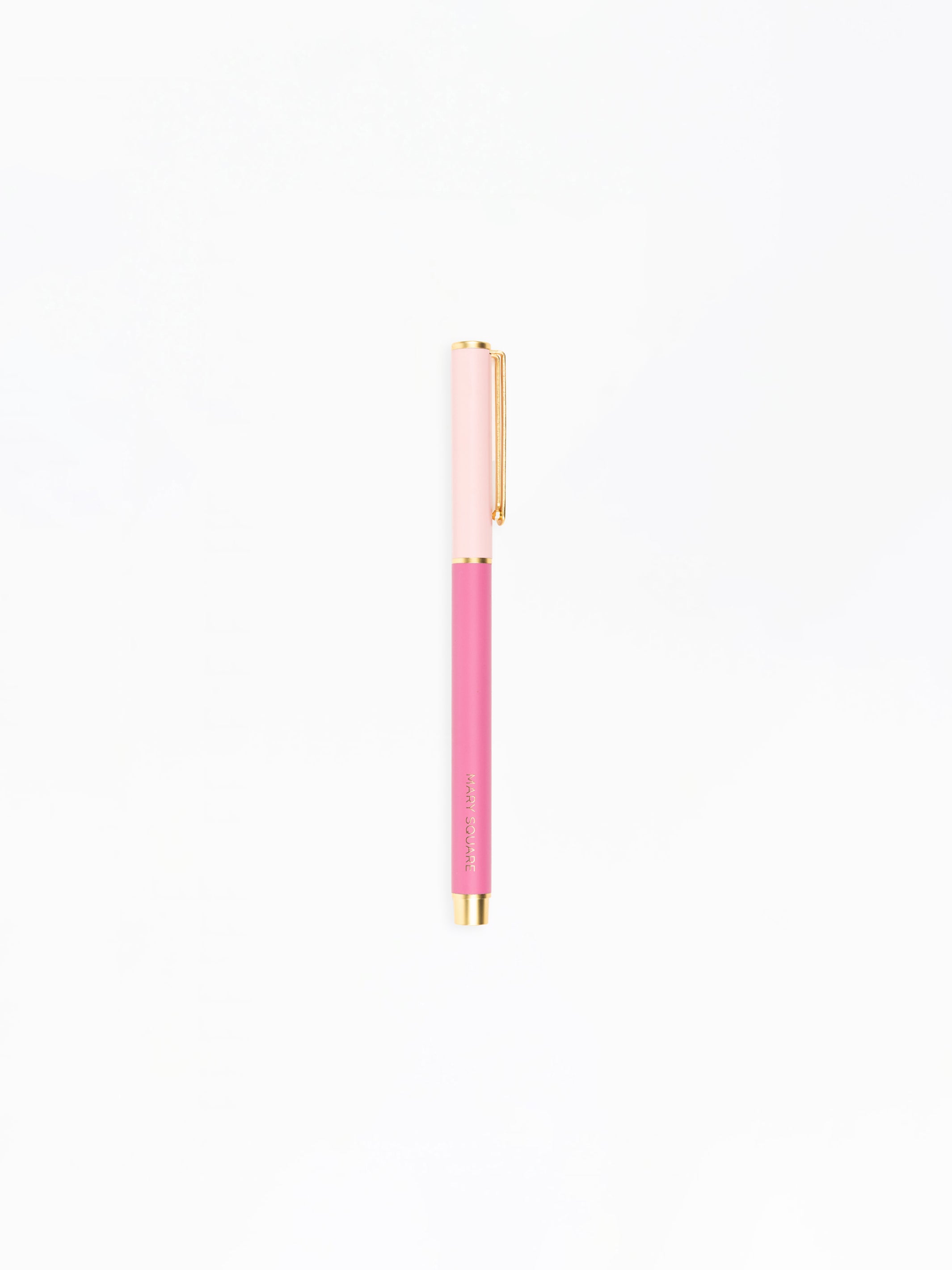 Pink pen with gold accents on a white background