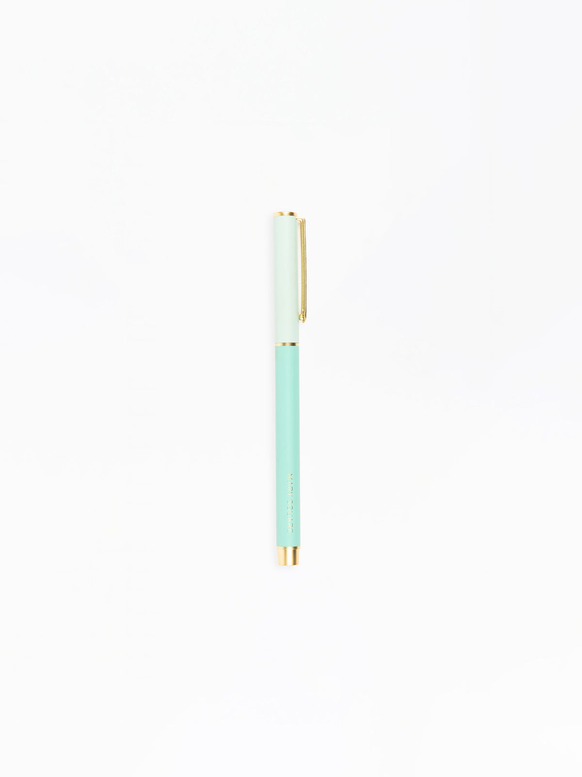 Mint green pen with gold accents on a white background