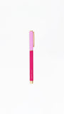 Pink pen with gold accents on a white background