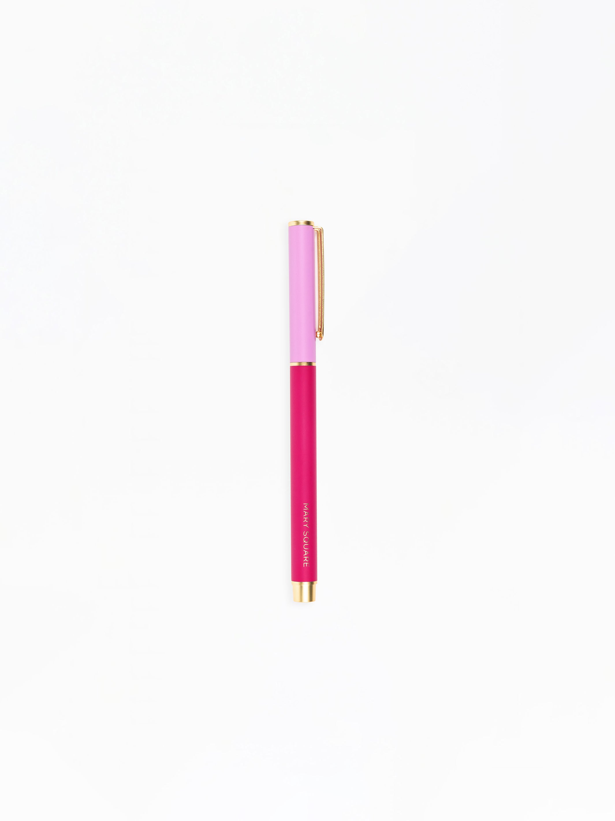 Pink pen with gold accents on a white background