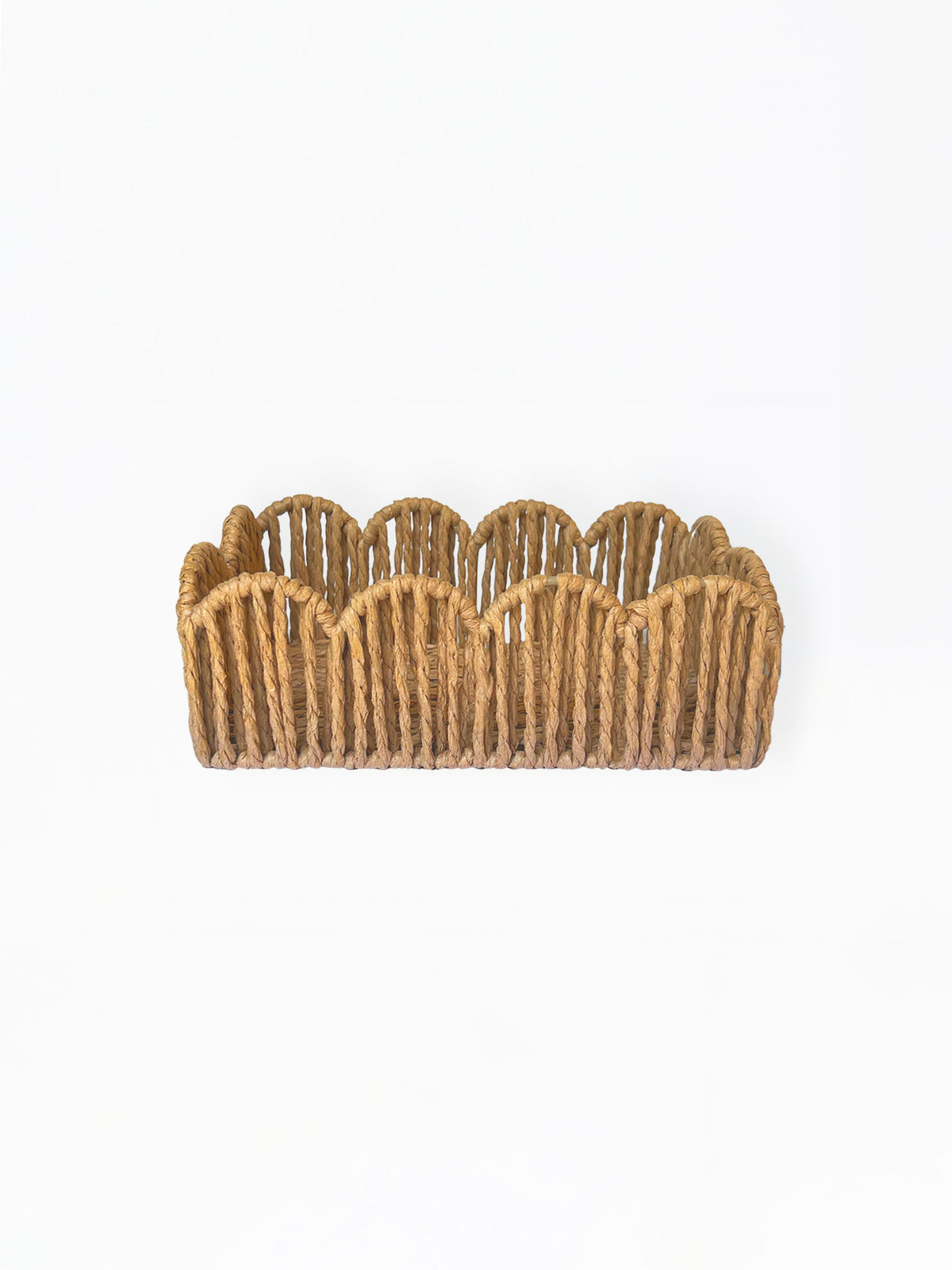 A small woven basket with a scalloped rim, made from natural tan jute or rope, photographed against a plain white background.