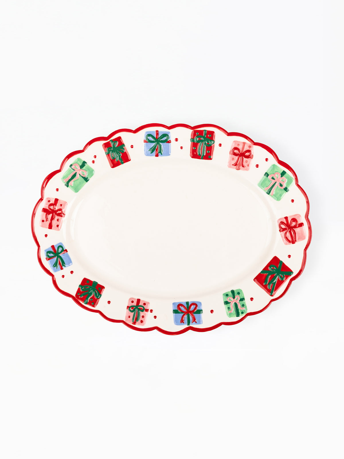 An oval white serving platter with a scalloped edge, decorated with a border of colorful gift boxes and red dots.