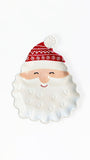 A ceramic Santa Claus face dish with a white textured beard, a beige face, a red patterned hat, and a white pom-pom, photographed on a clean white background.