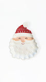 A ceramic Santa Claus face figurine with a white textured beard, a red and white patterned hat, and a small smiling face, set against a plain white background.