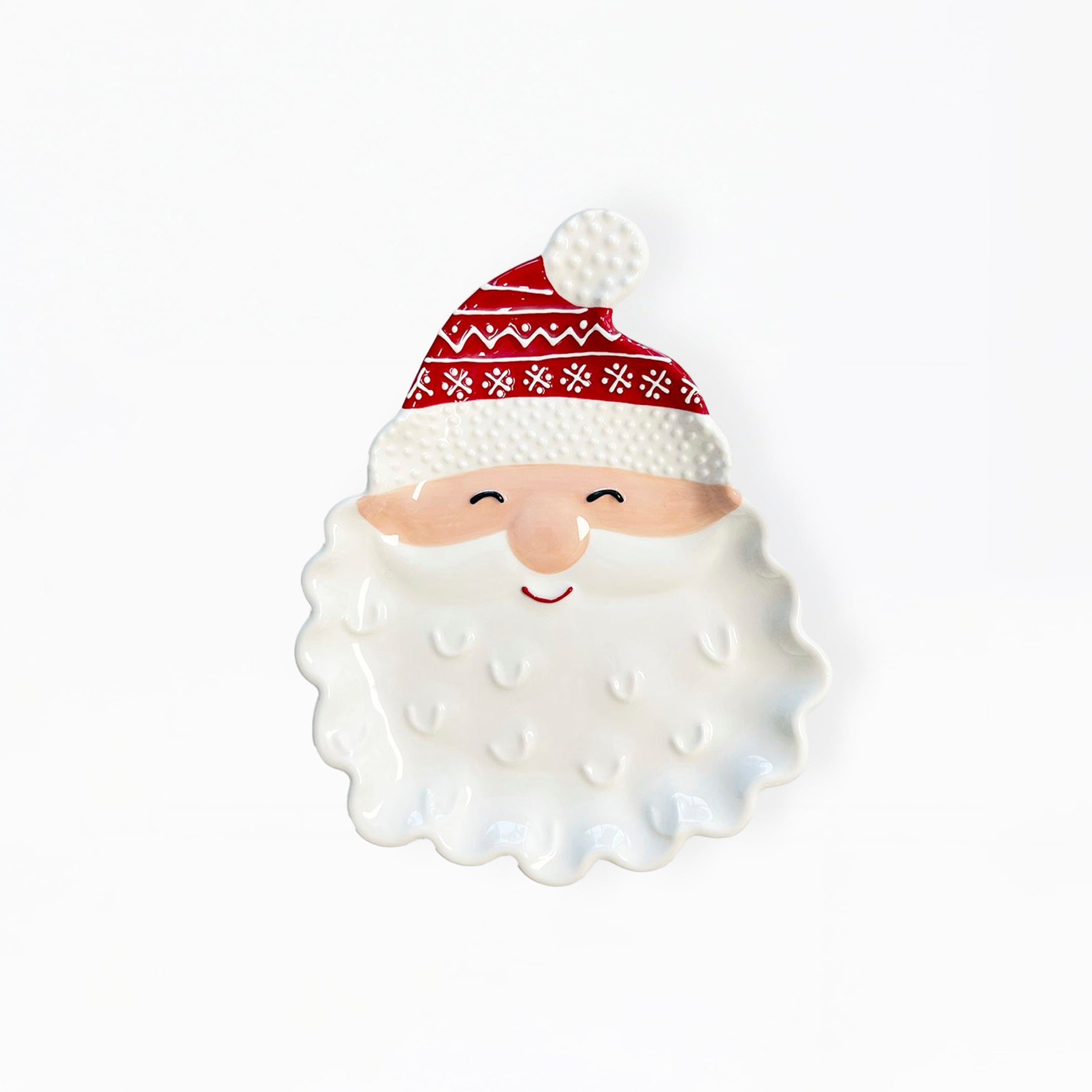 A ceramic Santa Claus face figurine with a white textured beard, a red and white patterned hat, and a small smiling face, set against a plain white background.
