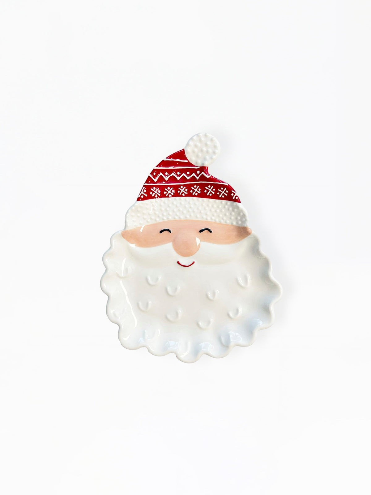 A ceramic Santa Claus face figurine with a white textured beard, a red and white patterned hat, and a small smiling face, set against a plain white background.