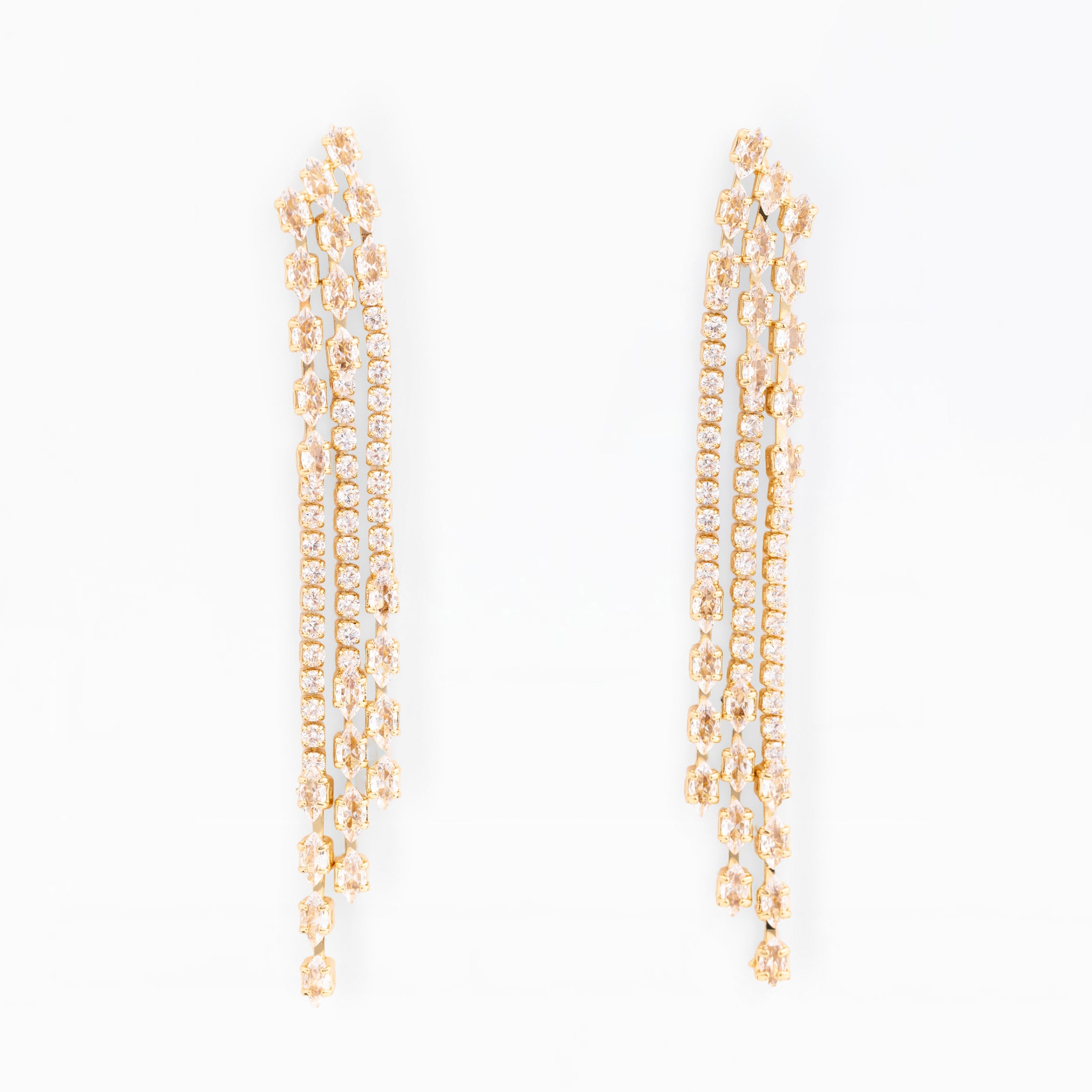 Gold chain earrings on a white background
