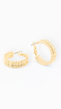 Gold hoop earrings on a white background