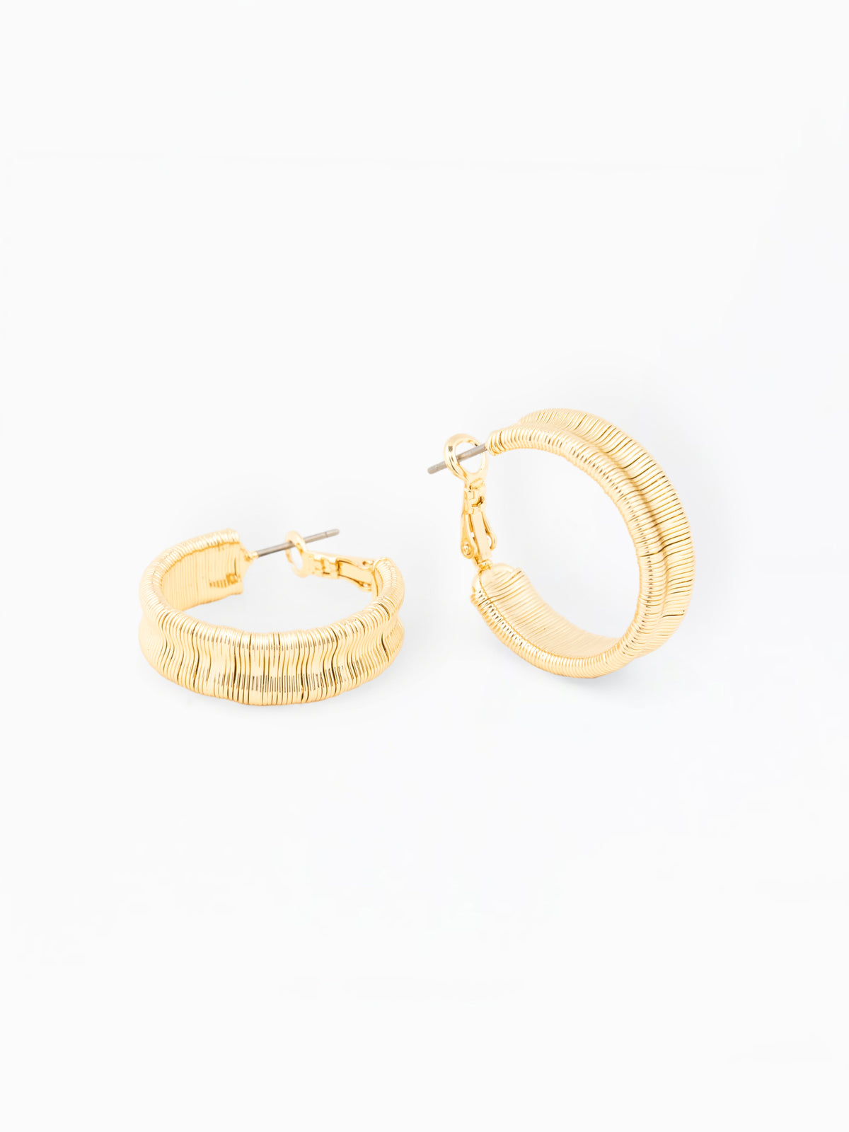 Gold hoop earrings on a white background