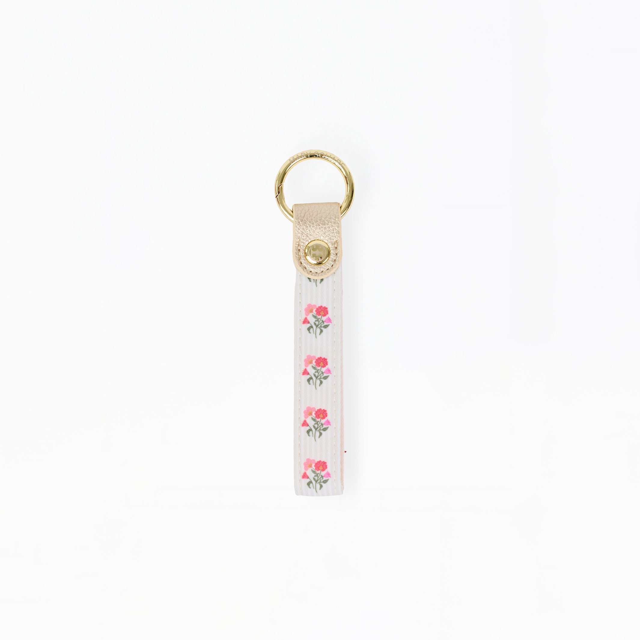 A white fabric keychain strap featuring a vertical pattern of pink roses with green leaves, finished with a beige leather tab and a gold-tone metal key ring at the top.