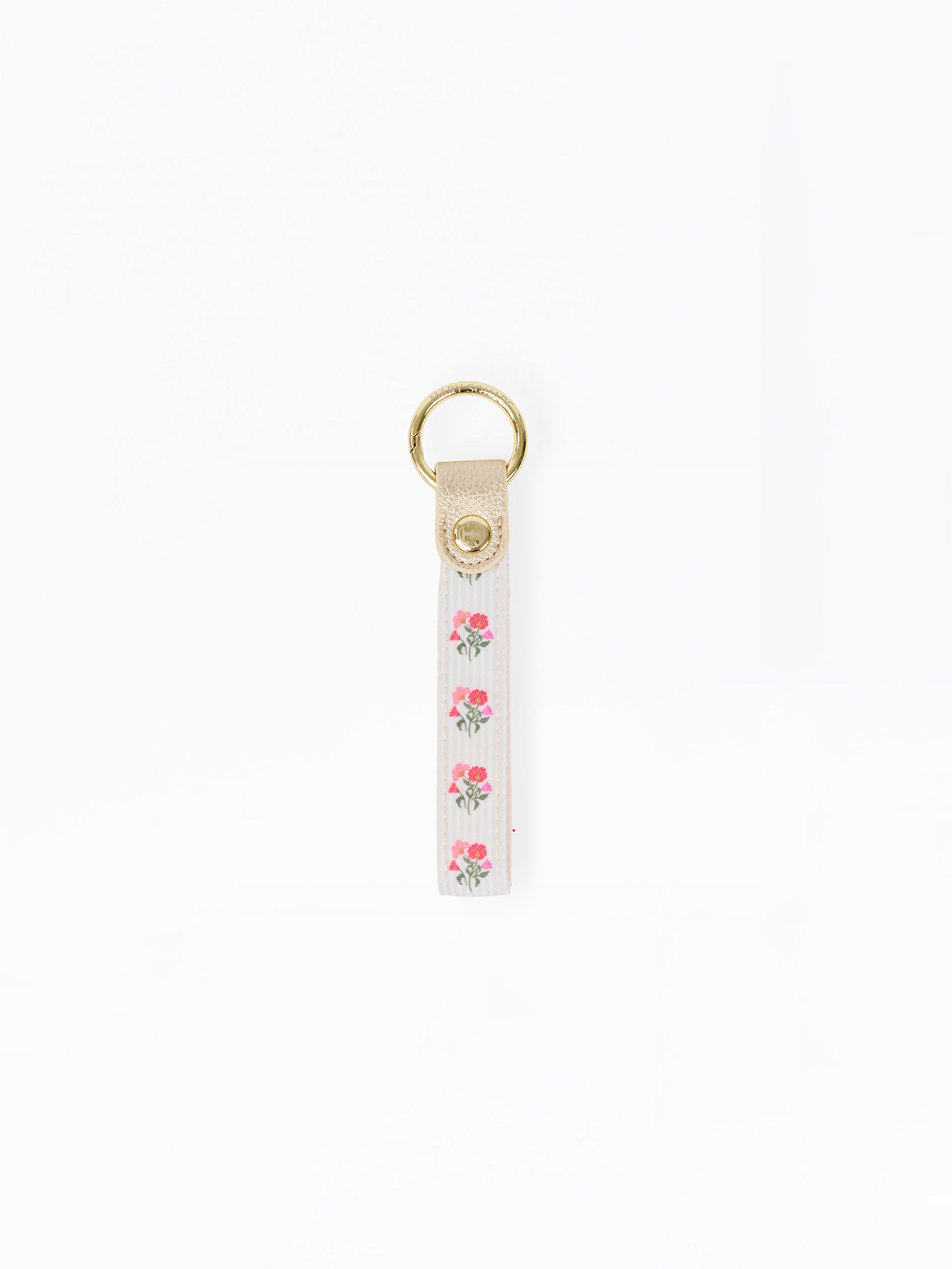 A white fabric keychain strap featuring a vertical pattern of pink roses with green leaves, finished with a beige leather tab and a gold-tone metal key ring at the top.
