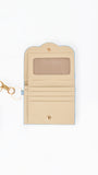 A light beige leather key card holder wallet with a light blue border, featuring a clear ID window, card slots, and a gold-tone keyring clasp, shown on a white background.