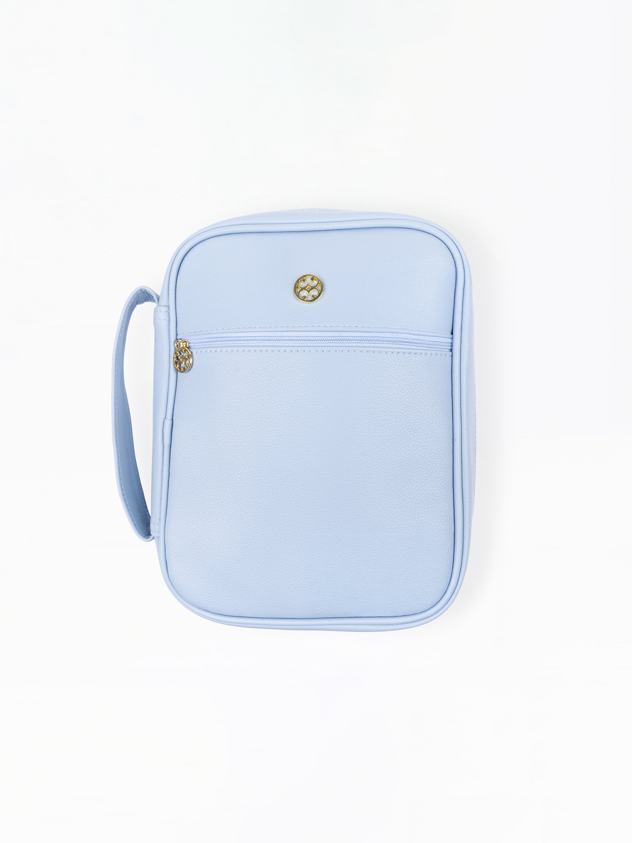 A light blue faux-leather bible cover with a front zippered pocket and a small gold-tone logo charm, shown on a plain white background.