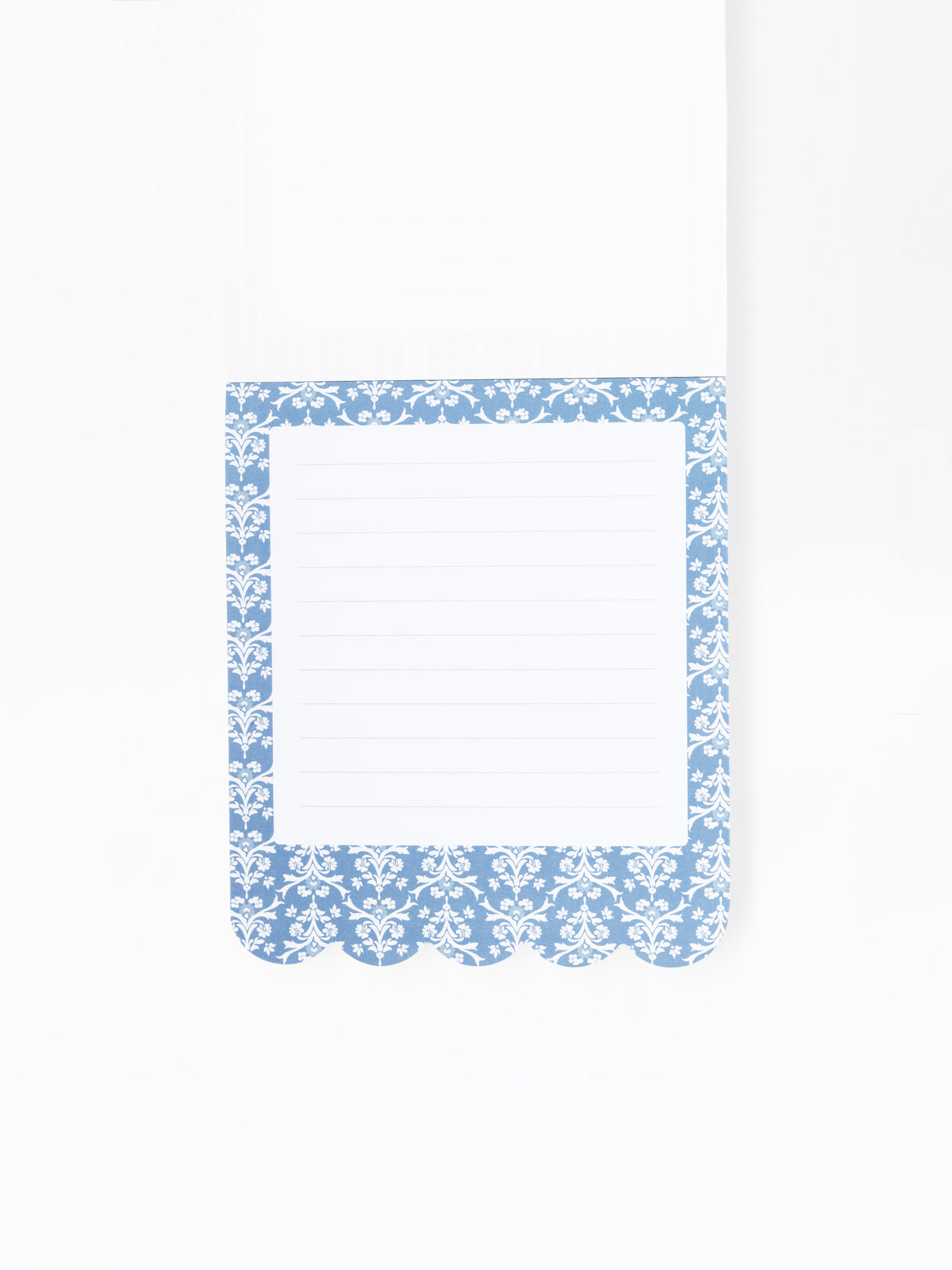 A white lined notepad page with a decorative blue and white damask-patterned border, shown on a clean white background.