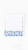 A small white to-do list notepad with a blue and white patterned border and scalloped bottom, shown on a plain white background.
