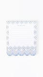 A white to-do list notepad with a decorative blue and white patterned border, featuring scalloped stripes at the bottom and the words 'TO-DO LIST' printed at the top.
