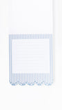 A white lined notepad with a blue and white striped border and scalloped edge, shown against a plain white background.