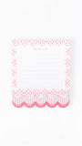 A pink and white to-do list notepad with a decorative patterned border, shown on a clean white background.