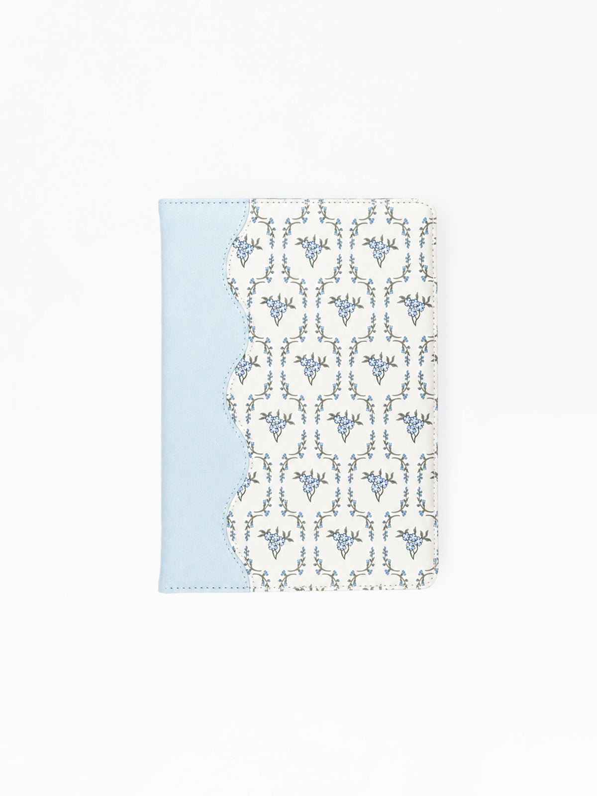A notebook featuring a light blue side panel and a white front cover with a repeating blue ornamental pattern, shown on a plain white background.