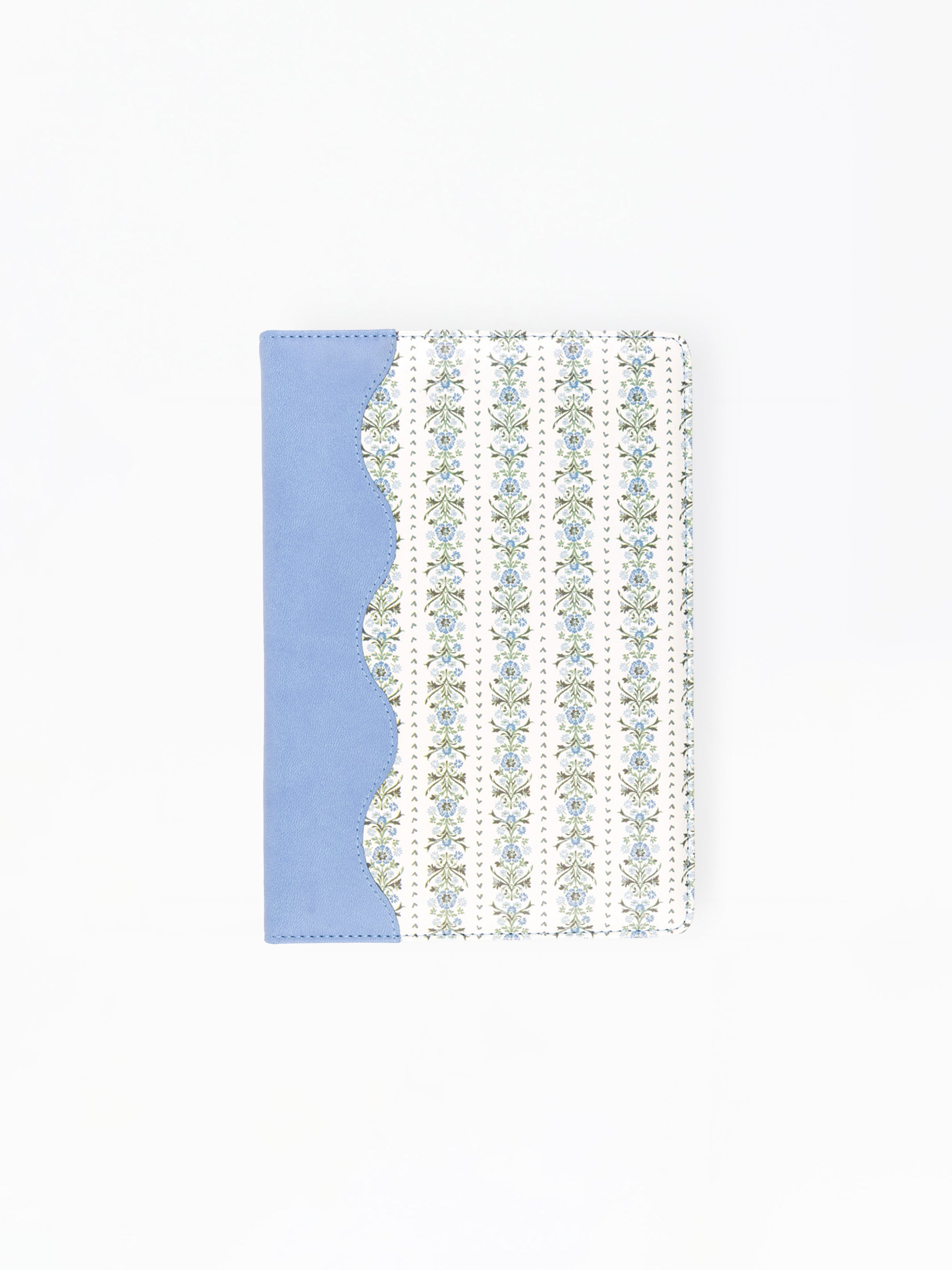 A notebook or journal with a light blue cover on the left and a white cover on the right featuring vertical stripes of small floral motifs, shown on a plain white background.