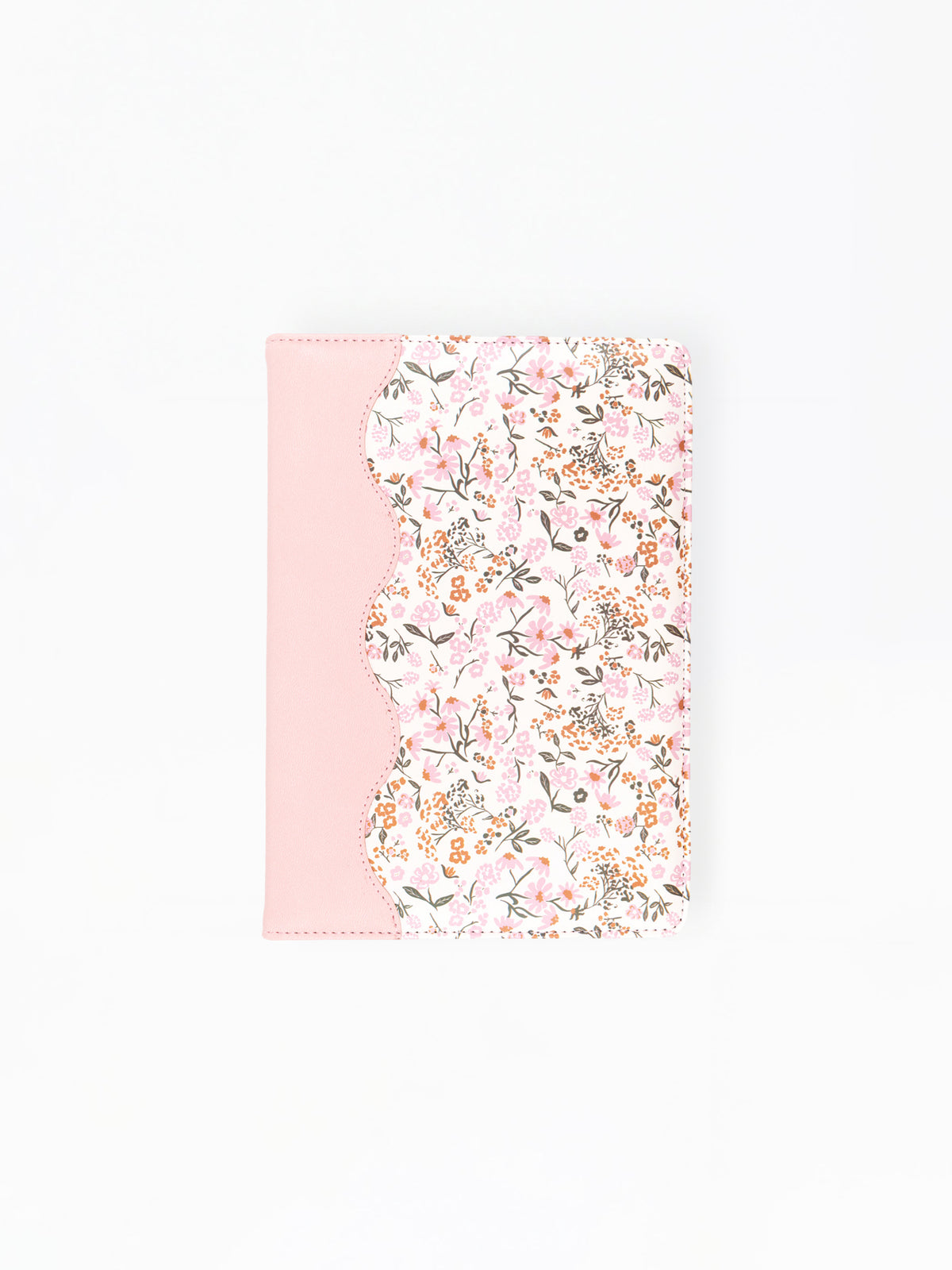 A notebook or journal cover featuring a light pink solid panel on the left and a scalloped edge with a dense pink, white, and green floral pattern on the right, shown against a plain white background.