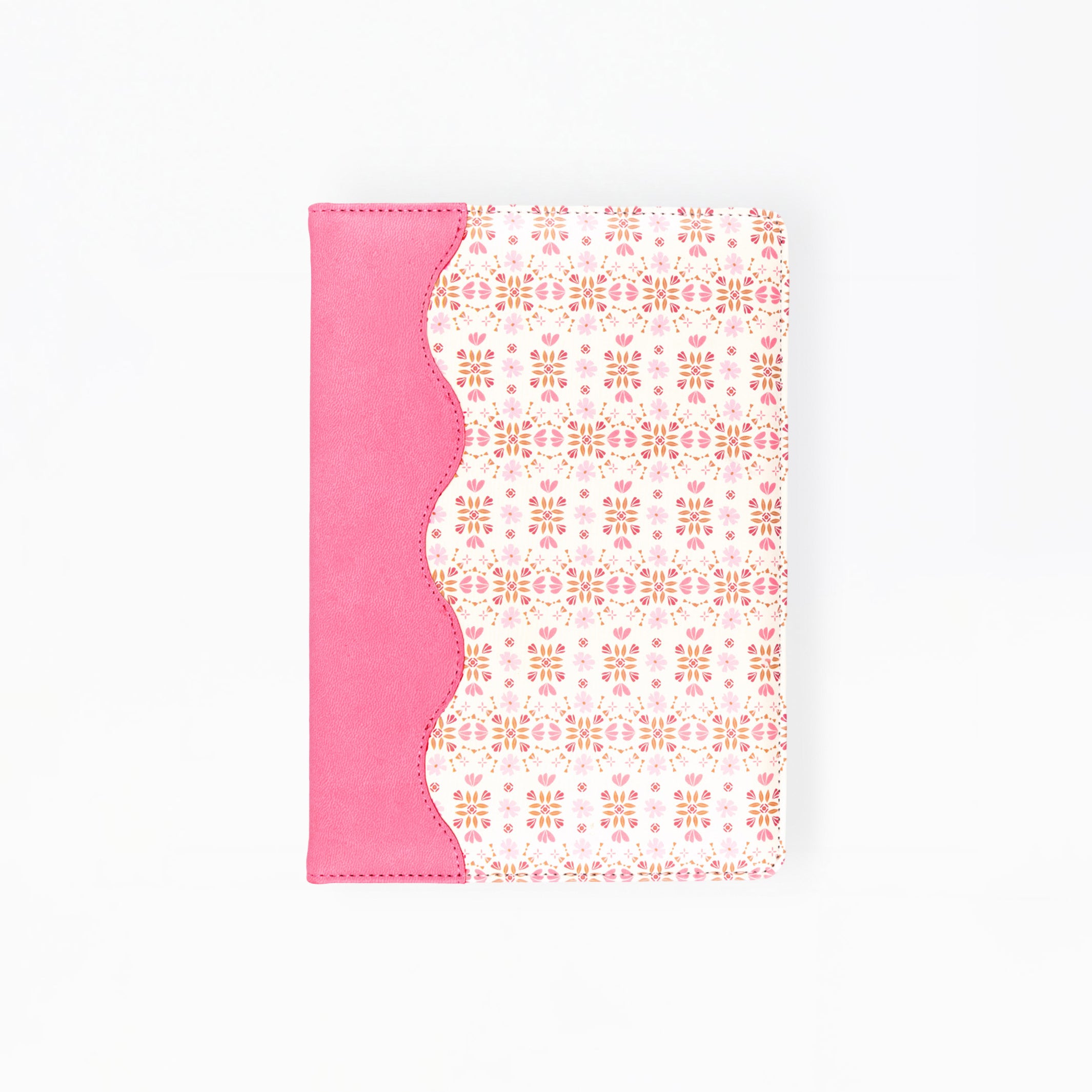 A notebook or journal with a bright pink cover on the left side and a white cover on the right featuring a delicate pink geometric pattern, separated by a scalloped pink border.
