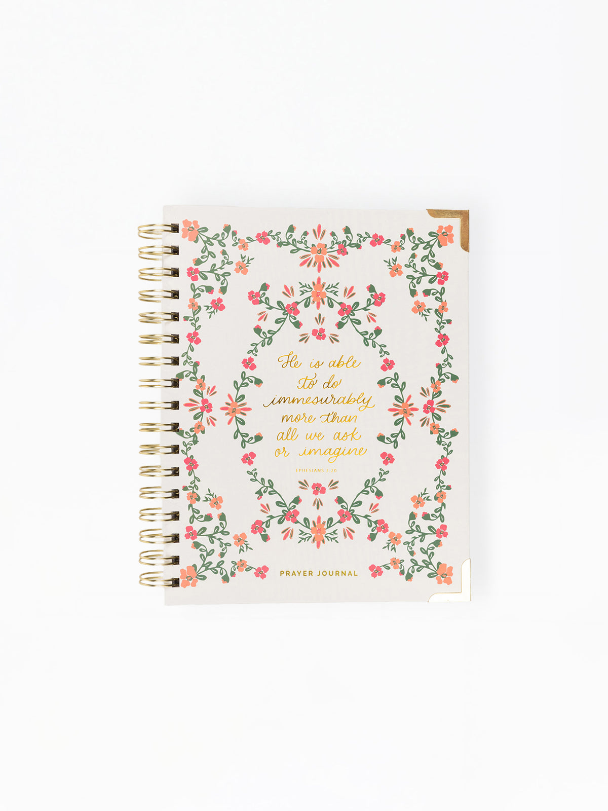 A spiral-bound prayer journal with a cream-colored cover decorated with a pink and green floral wreath and gold foil lettering, shown on a plain white background.