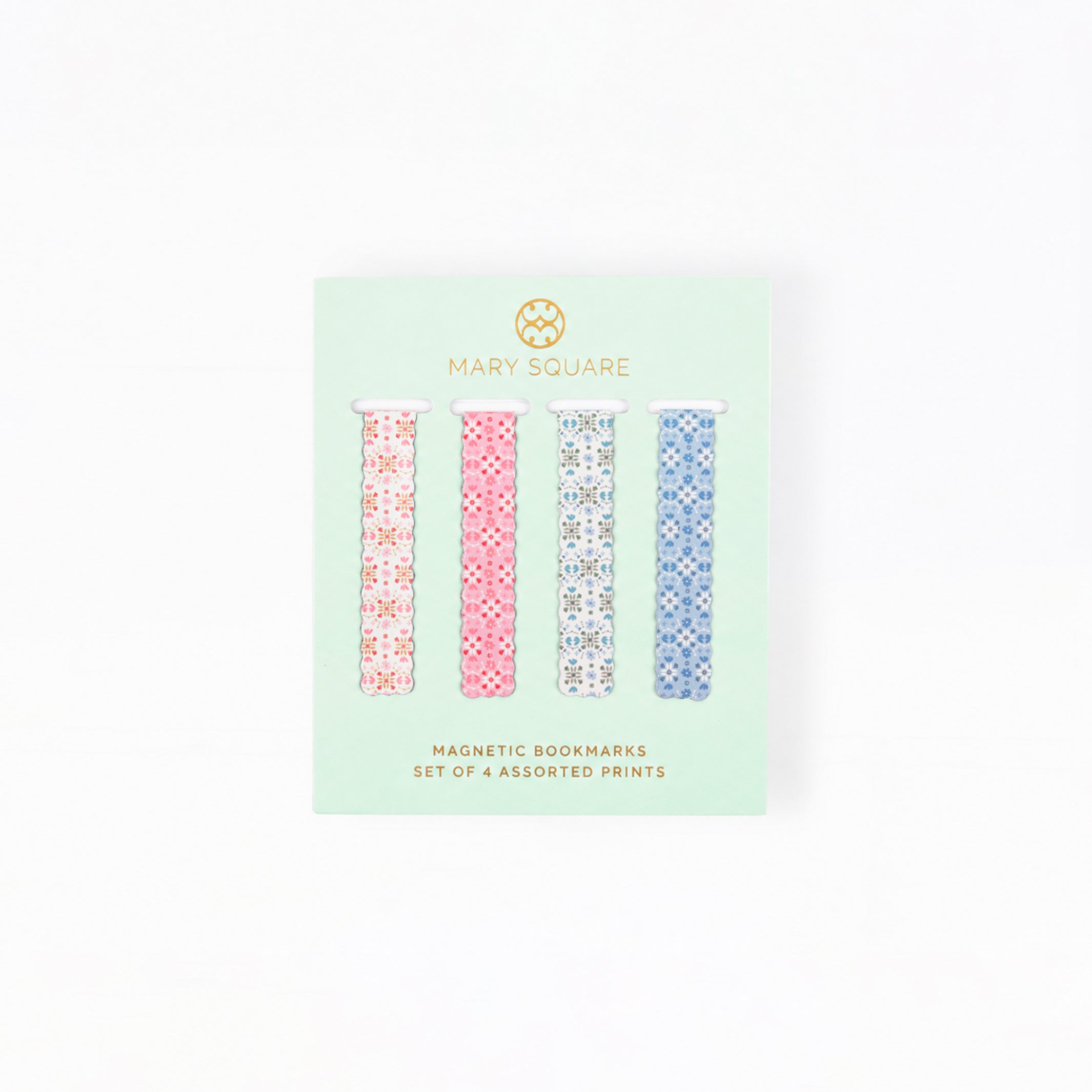 A package of four Mary Square magnetic bookmarks featuring assorted geometric patterns in pink, blue, and white, presented on a mint green backing card.