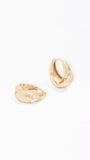 A pair of gold huggie hoop earrings with small clear gemstone accents, displayed on a clean white background.