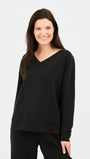 Woman wearing a black sweatshirt on a white background