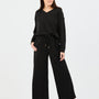 Woman wearing a black outfit on a white background