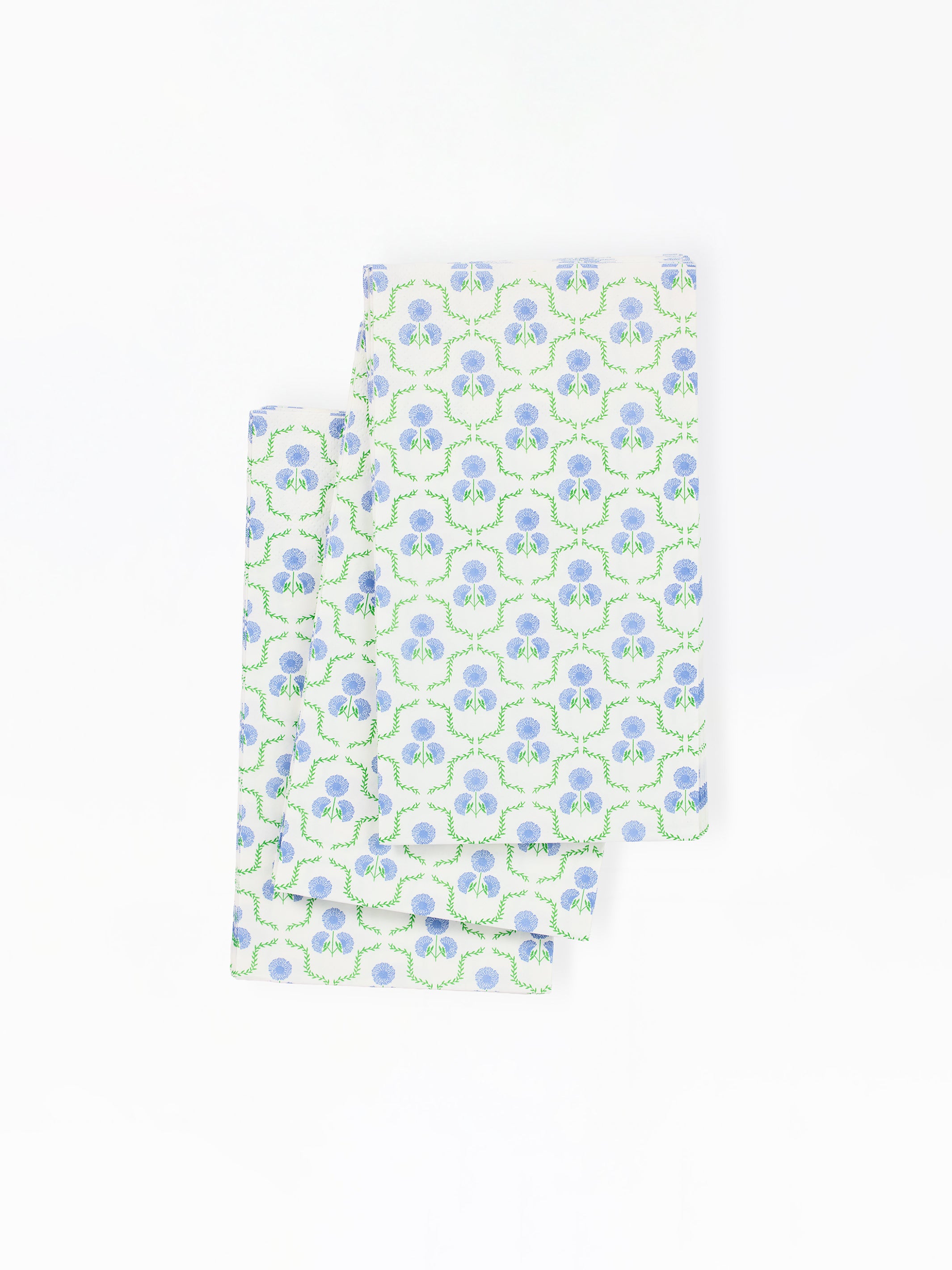 paper napkins with a blue and green floral pattern on a white background