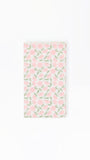 paper guest napkins with a pink floral pattern on a white background