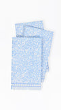 Light blue paper napkins with floral pattern on a white background