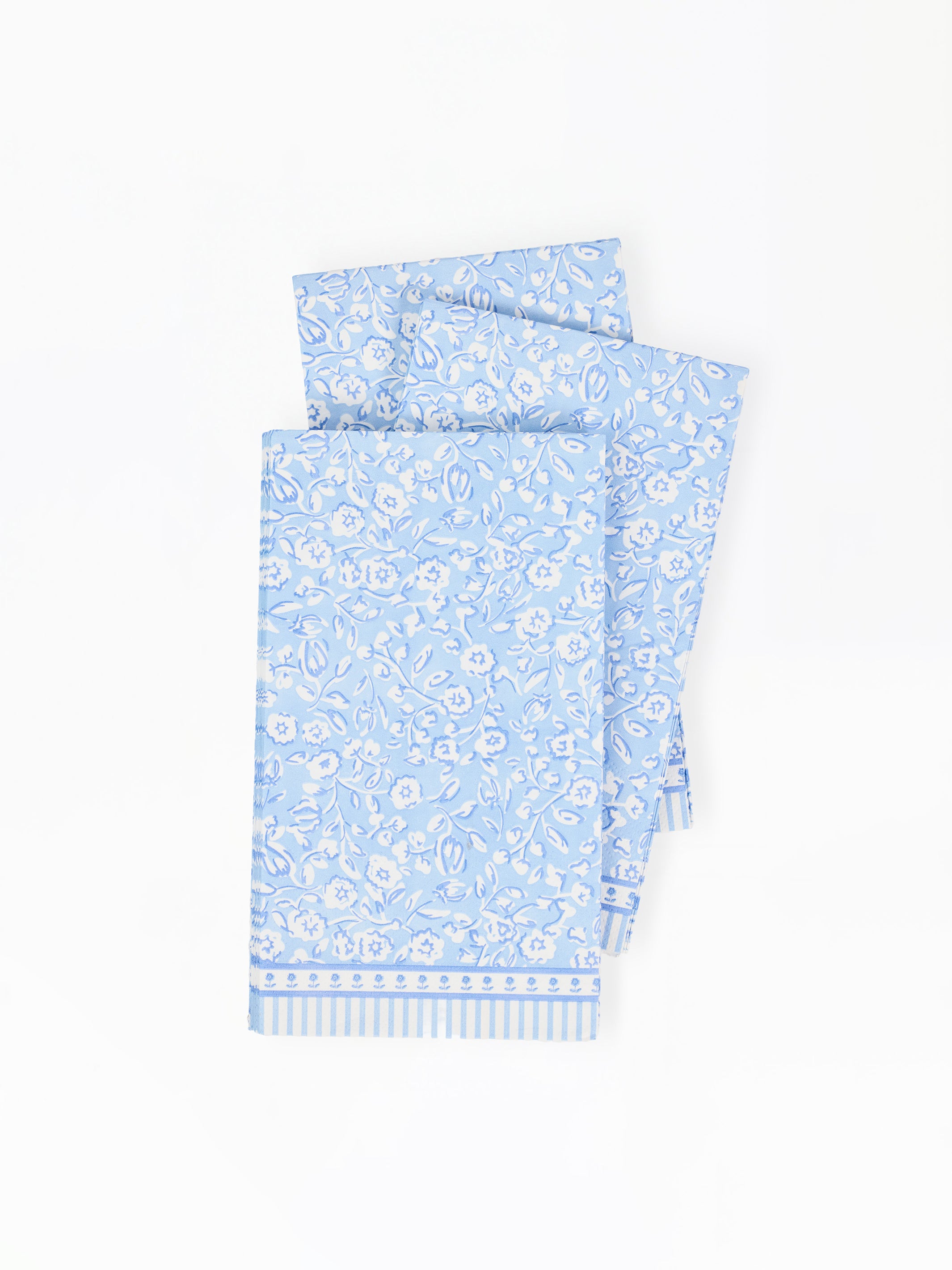 Light blue paper napkins with floral pattern on a white background