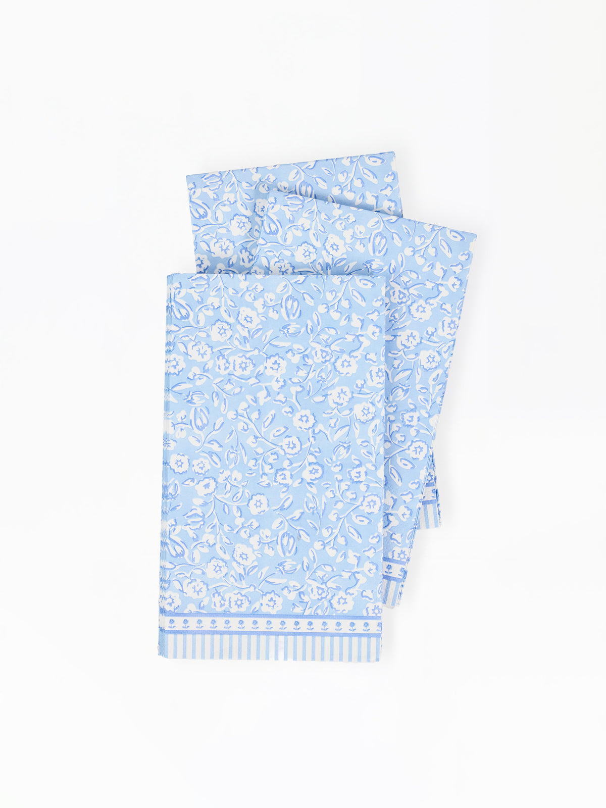 Light blue paper napkins with floral pattern on a white background